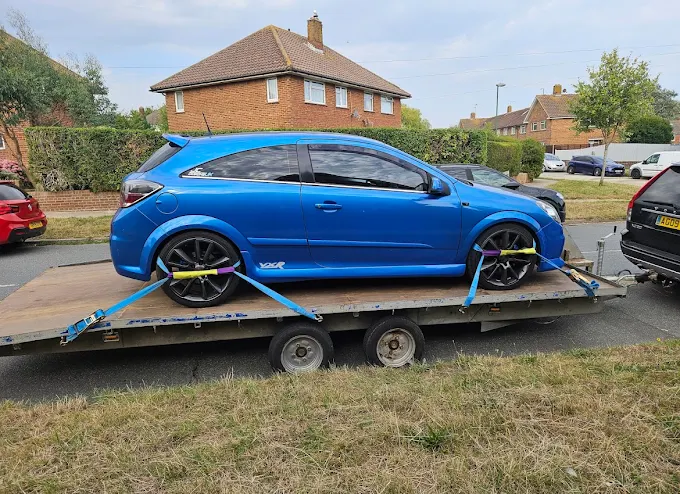 Car secured on a transporter trailer